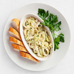 boiled calamari salad with cucumber and cabbage  dressed with mayo and french mustard based sauce...