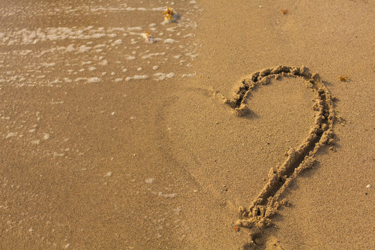  Half of Heart on the Sand in the Beach.