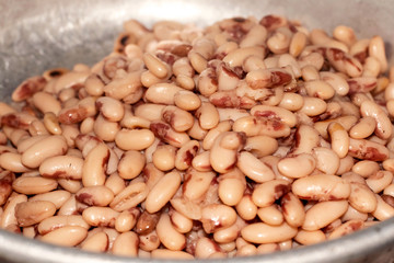 Beans, soybeans prepared in aluminum bowl, simple rustic food.