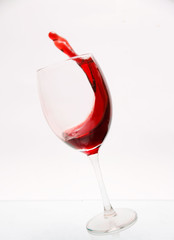 A glass of splashing red wine