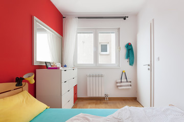 Cozy modern colorful bedroom interior with bed sheet