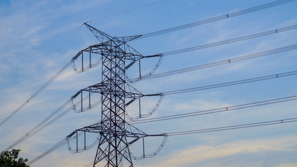 Low Angle View Of Electricity Pylon Against Cloudy Sky