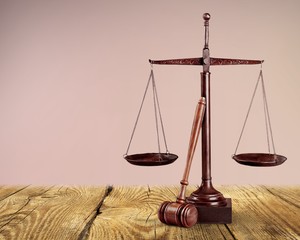 Law scales on table background. Symbol of justice