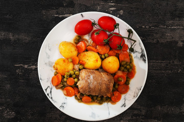 Beef meat stewed with potatoes-Traditional French cuisine Beef Bourguignon potatoes carrots in persillade