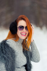 Portrait of beautiful red hat woman in the winter forest