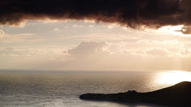 Greek coastline at early morning after sunrise with dark stormy clouds, Greece Peloponnese Mani. Time lapse 4K