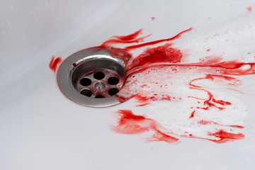 Flowing blood in the sink. Murder concept background