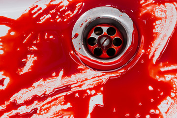 Flowing blood in the sink. Murder concept background