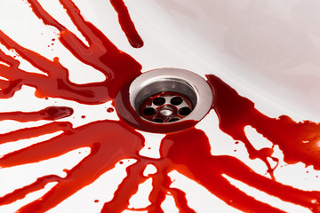 Flowing blood in the sink. Murder concept background