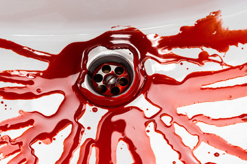 Flowing blood in the sink. Murder concept background