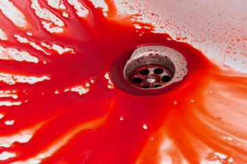 Flowing blood in the sink. Murder concept background