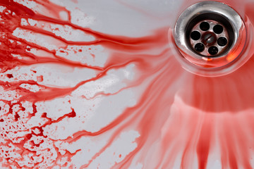Flowing blood in the sink. Murder concept background