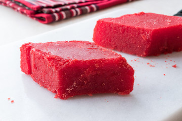 Crystallized Turkish Delight Red Sugar. Crystal Confectionery Nobet Sekeri on White Marble Surface.