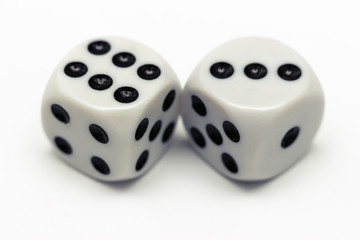 Black and white dices against a white background
