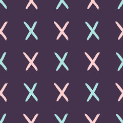 Repeating crosses drawn by hand with a rough brush. Simple girly seamless pattern. Sketch, paint, grunge. Purple, blue, pink.