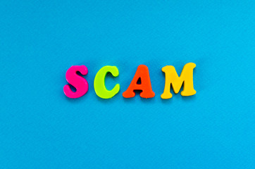 scam on blue paper background