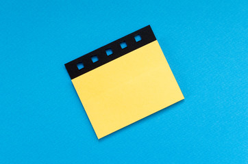 blank post it sticker on blue background