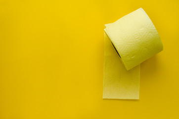 yellow toilet paper roll on yellow backgroung