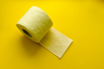 yellow toilet paper roll on yellow backgroung