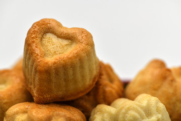 Valentine's day. Closeup of delicious cupcakes in the shape of a heart. Macro photography