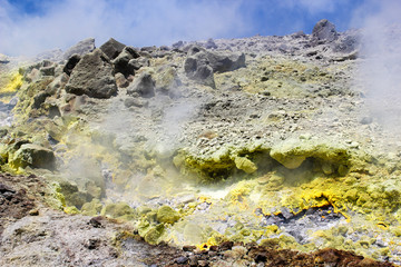 Steam of a volcanic spring with yellow sulphur at Vulcano, an Aeolian island in Sicily, Italy