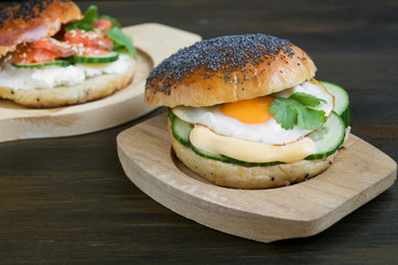 egg and cucumber sandwich on wooden background.