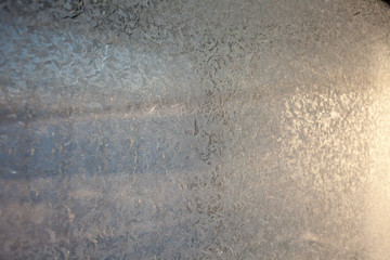 Obraz premium winter patterns on glass. Ornate frost pattern on frosted window as Christmas background