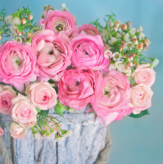 Close-up floral composition with a pink Ranunculus flowers . Beautiful bouquet of a spring flowers. 