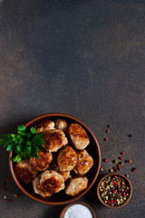 Meat balls with spices on a concrete background. View from above.