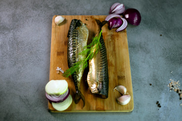 smoked mackerel on a wooden kitchen board