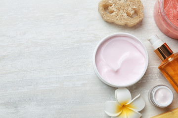 Flat lay composition with body care products and space for text on light background