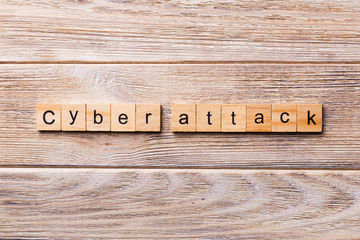 Cyber attack word written on wood block. Cyber attack text on wooden table for your desing, concept