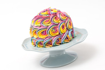 A birthday cake displayed isolated on white background