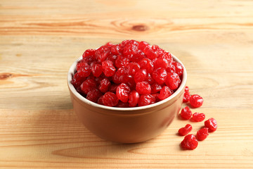 Bowl of sweet cherries on wooden background. Dried fruit as healthy snack