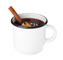 Mug of mulled wine with spices isolated on white