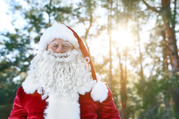 Happy Authentic Santa Claus outdoors, space for text