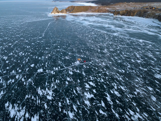 Aerial photo of Shaman rock, bay and Cape Burkhan on Olkhon island in winter. Beautiful view on frozen Baikal lake. Sunny. © dimabucci