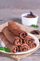 Thin crepes or blinis with chocolate cream