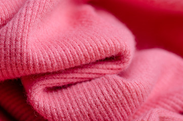 Fabric warm pink sweater buttons textile material texture blur background macro