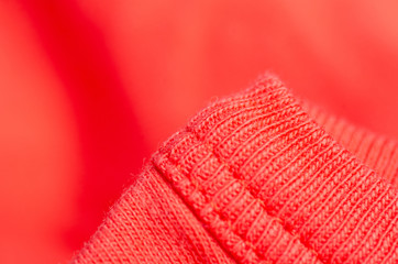Fabric warm red orange sweater textile material texture blur background macro
