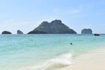 Fototapeta premium Beautiful lonely beach with a big mountain in background at Poda Island in Krabi, Thailand, Asia