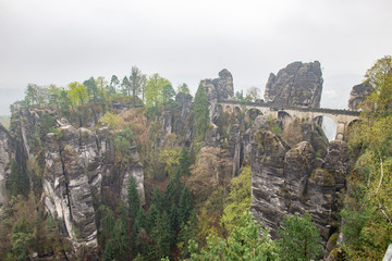 Fototapeta na wymiar Bastei Dresden Germany.Park Saxon Switzerland.The cliffs are located not far from Rathen near the town of Pirne in the south-east of Dresden.The rocks in the fog.Beautiful landscape.Mountains travel.
