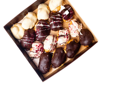 mini chocolate eclairs, isolated on white, ekler