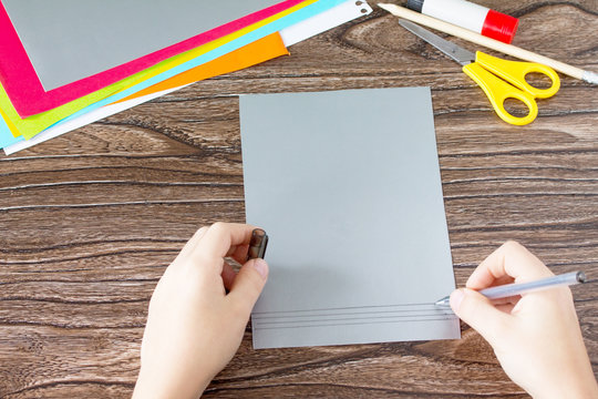 The child draws details Greeting card with birthday cake congratulation. Children's art project craft for kids. Craft for children.
