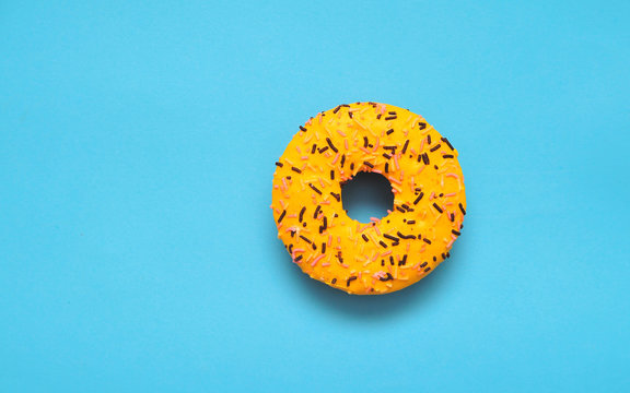 Delicious donut on colorful background.
