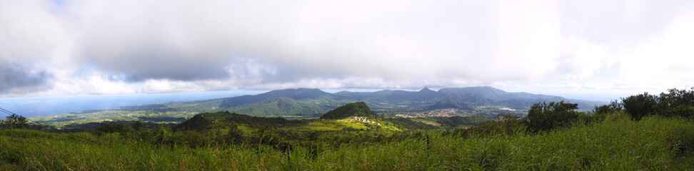 Fototapeta na wymiar Panoramic view of the Atlantic coast of Martinique and the village of Morne Rouge from the refuge at the foot of Mount Pelée