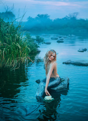 gorgeous fairy-tale princess mermaid because of curse, girl with long blond hair and silver tail...