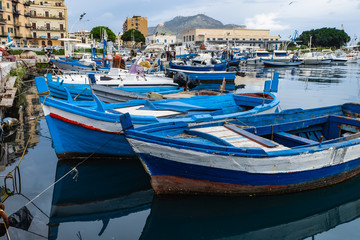 Fototapeta na wymiar Fishing wooden boats in the harbor of Palermo