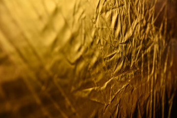 gold dented background. reflector macro. the backdrop for postcards