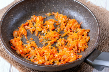 Chopped carrots frying on the pan